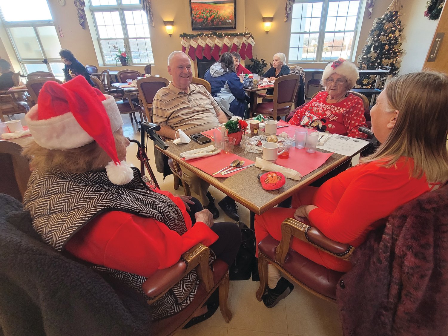 CHRISTMAS PARTY: Members of the Johnston Senior Center had drinks and snacks prior to a rousing performance by the Johnston High School Chorus.